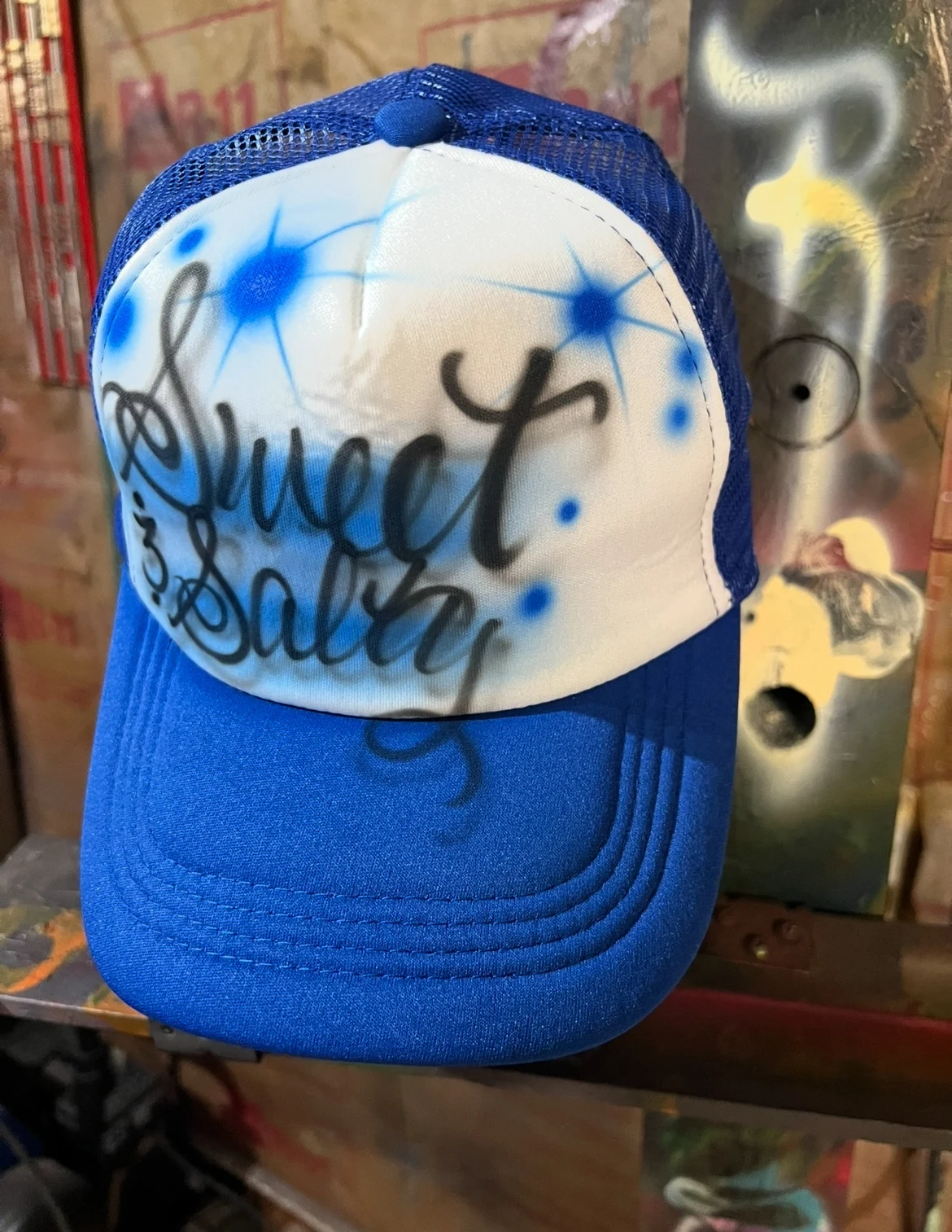 Blue and white trucker hat with Sweet and Salty lettering airbrushed for the 7 Brew Nashville event