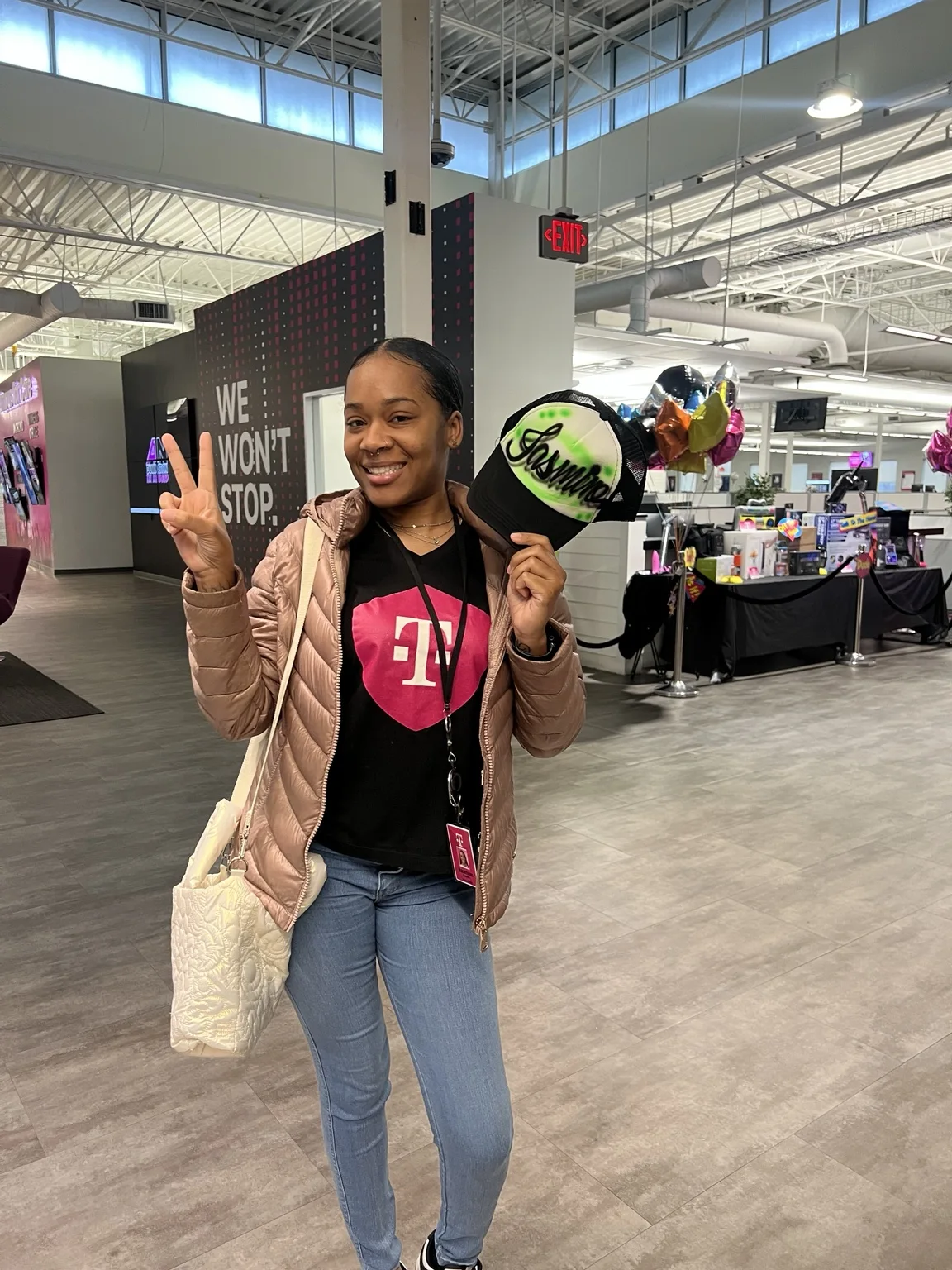 T-Mobile event guest showing personalized airbrushed hats in Augusta, Georgia