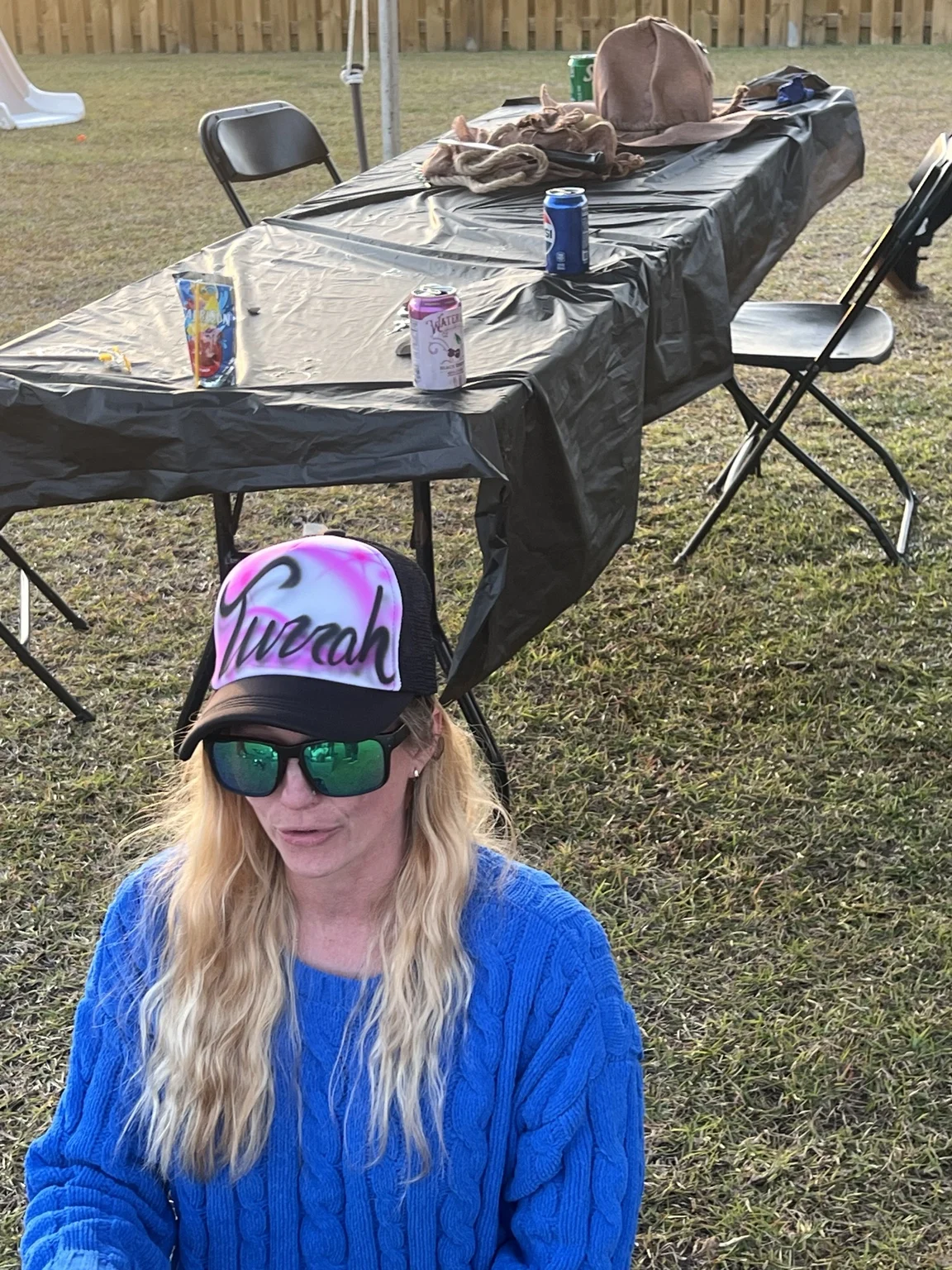 Guest showing a custom airbrushed trucker hat in Austin, Texas