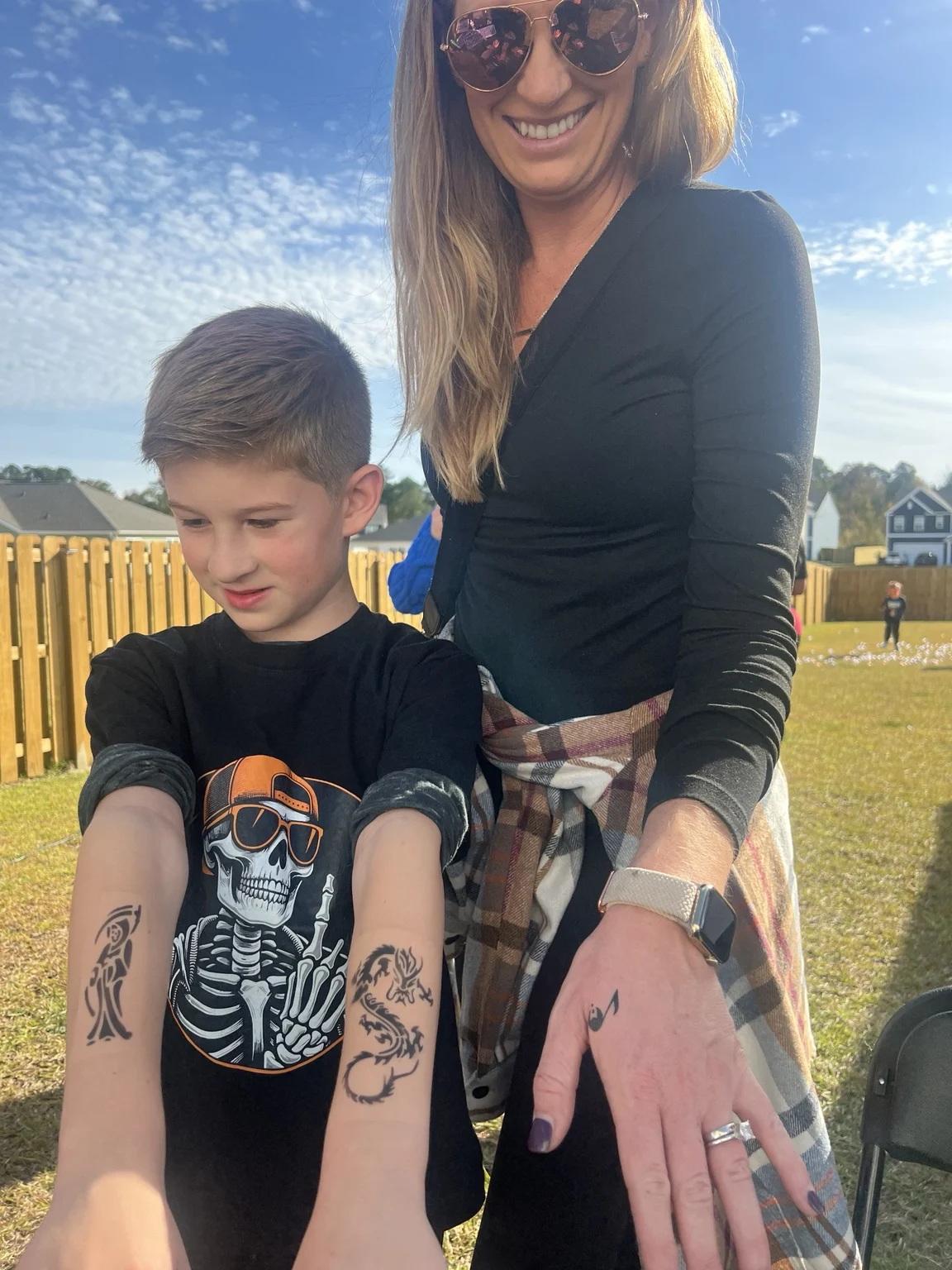 Guests showing their temporary airbrush tattoos in Austin, Texas