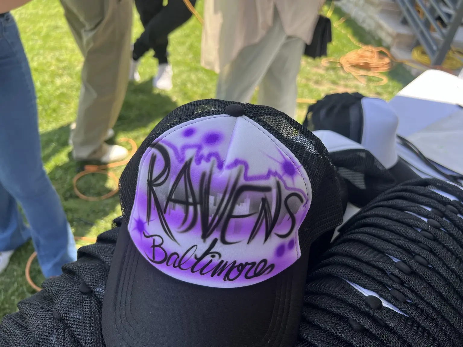 Purple Baltimore Ravens themed airbrushed trucker hat