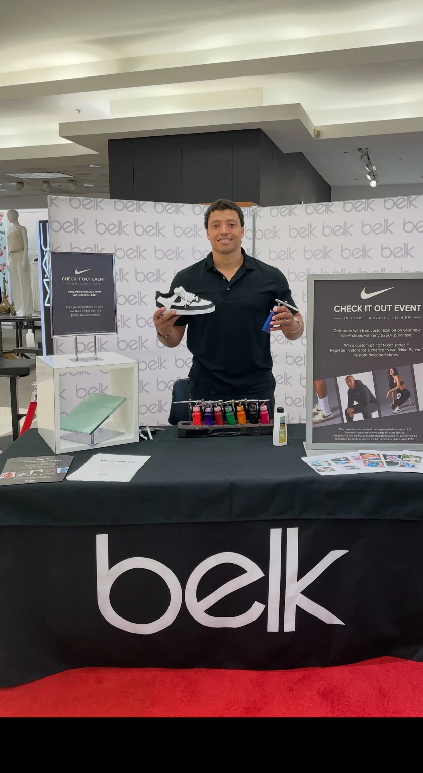 Live airbrush customization station at Belk