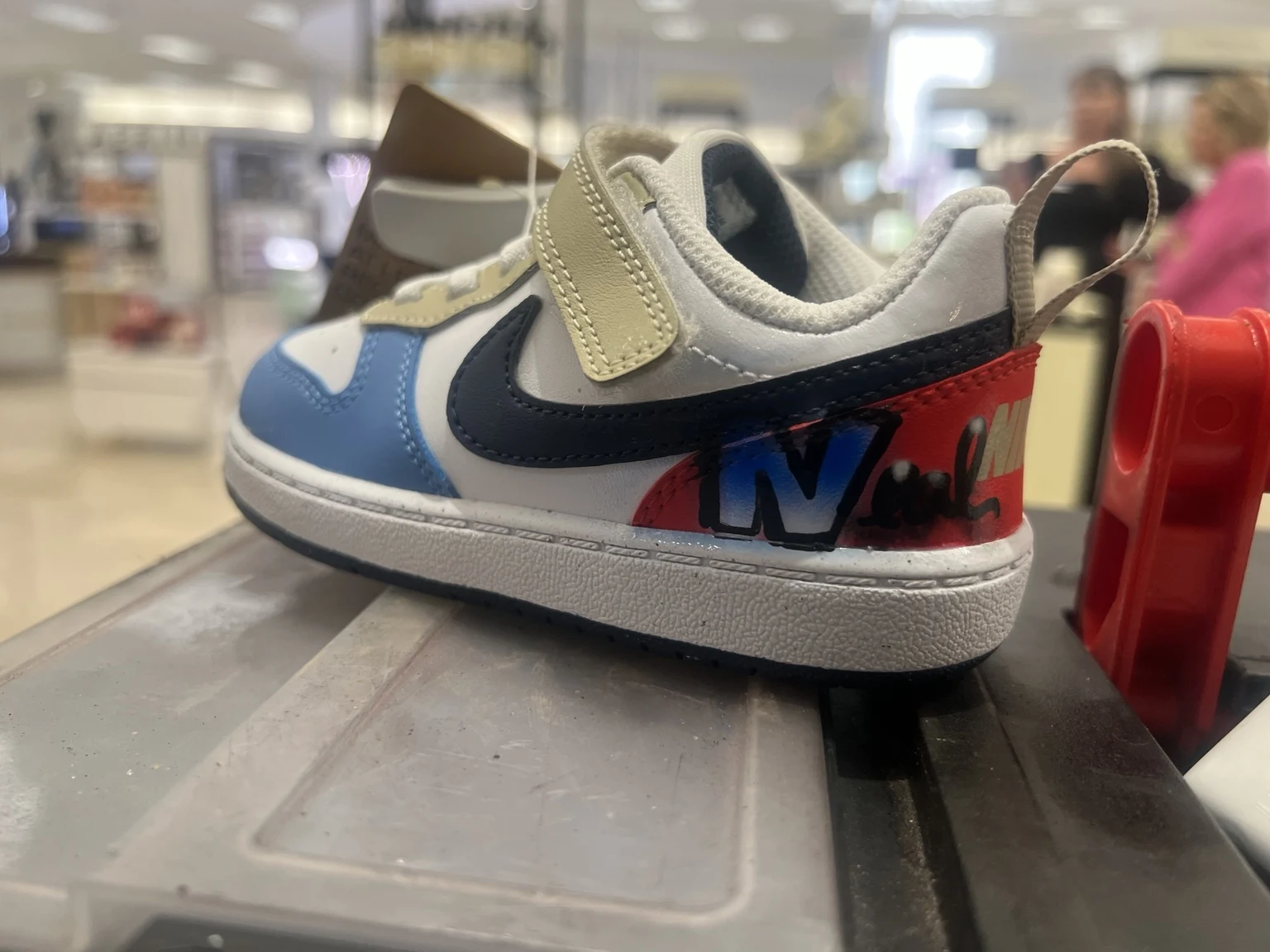 Personalized Nike shoe displayed at the Belk activation