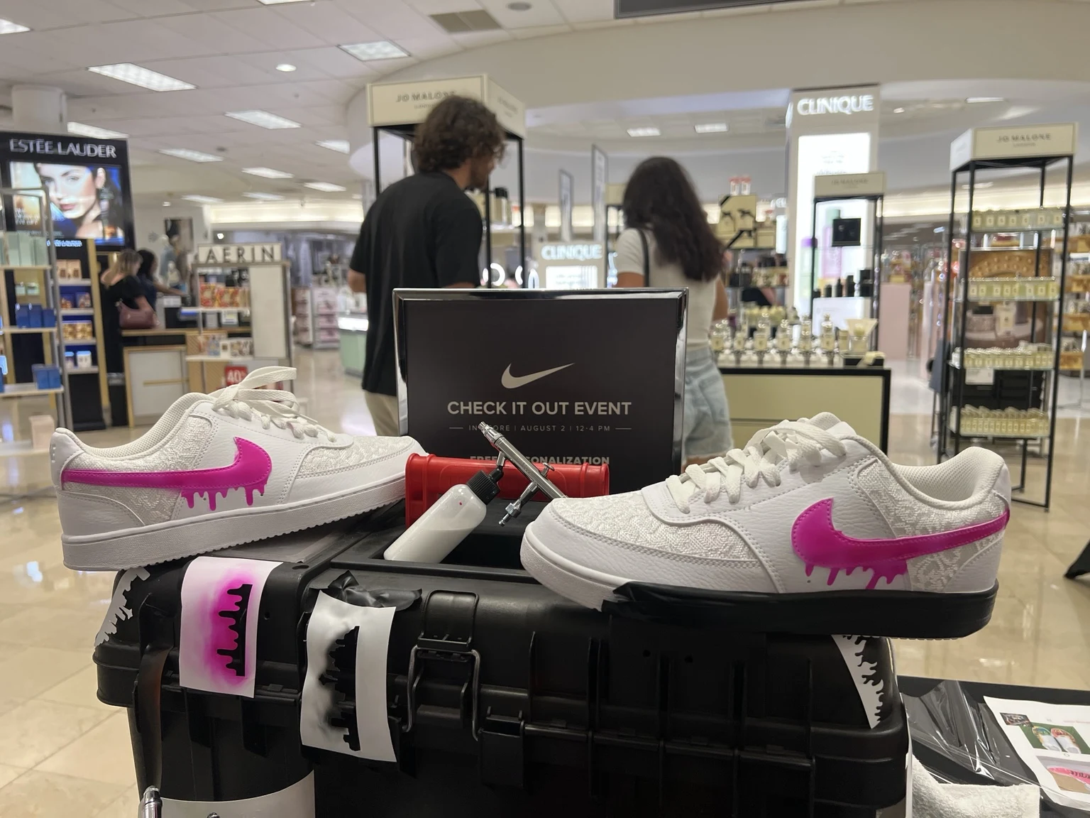 Nike sneakers with pink airbrushed details at Belk