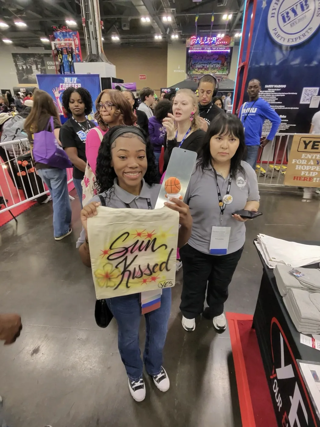 Birmingham college students showing their custom airbrushed shirts