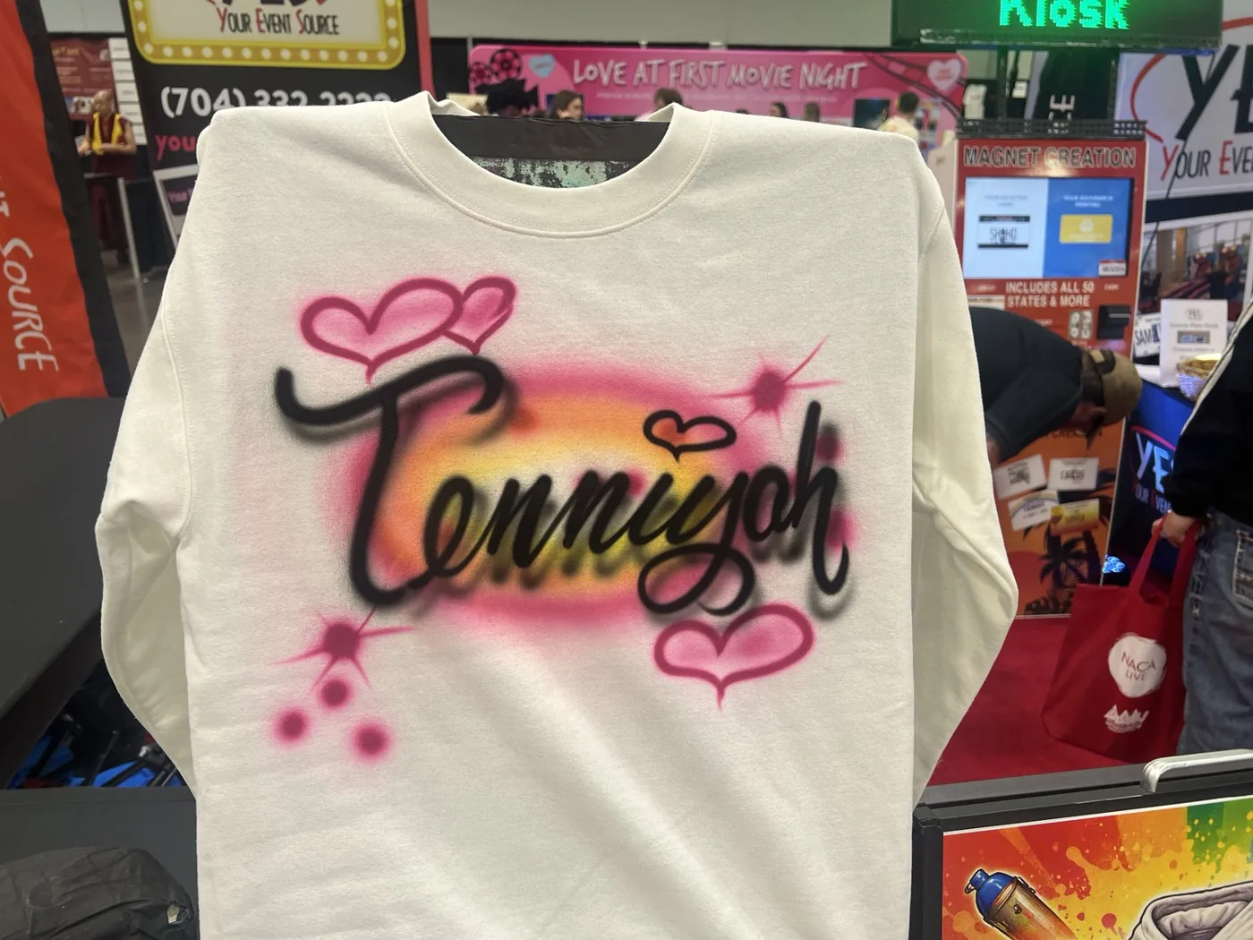 Detail of a personalized airbrushed sweatshirt at the Birmingham event