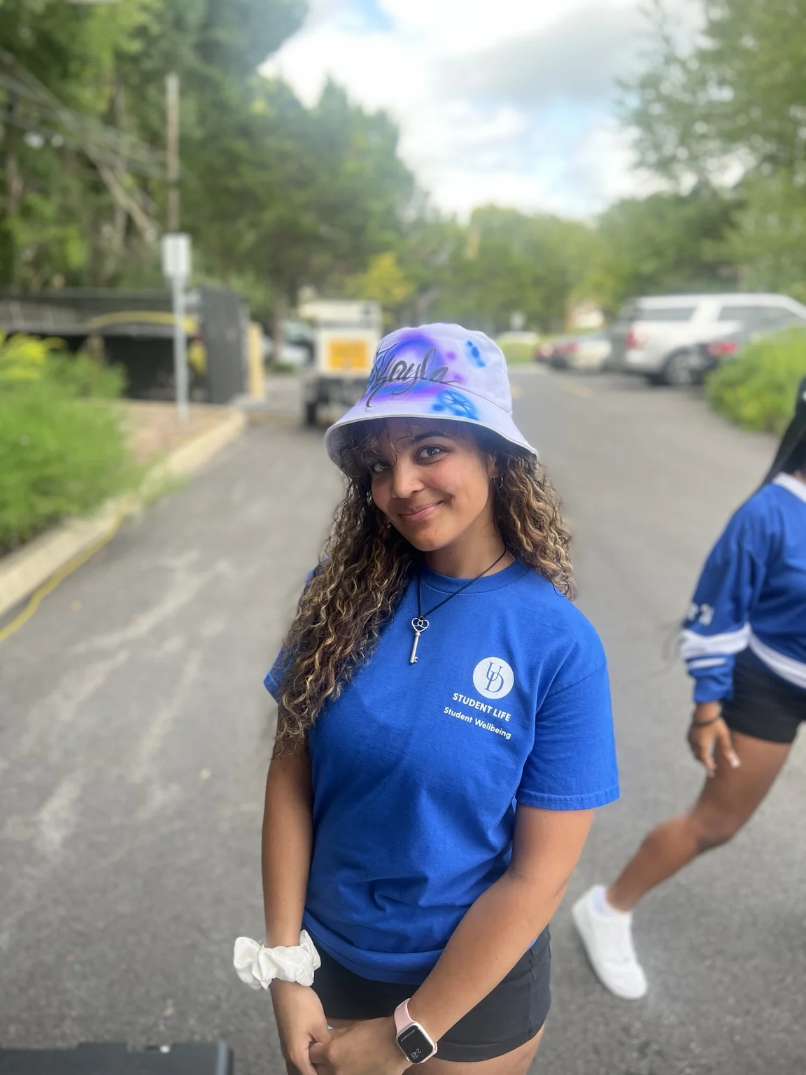 Delaware State University student with a personalized airbrushed hat — event photo 3