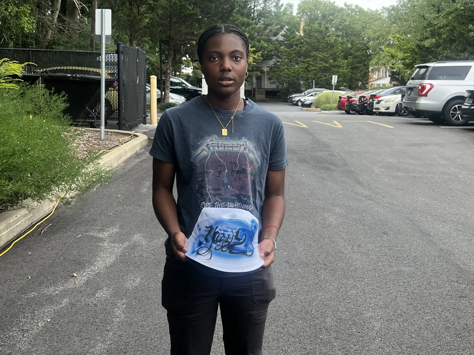 Delaware State University student with a personalized airbrushed hat — event photo 6