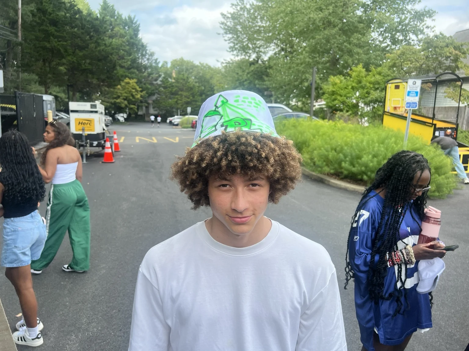 Delaware State University student with a personalized airbrushed hat — event photo 8
