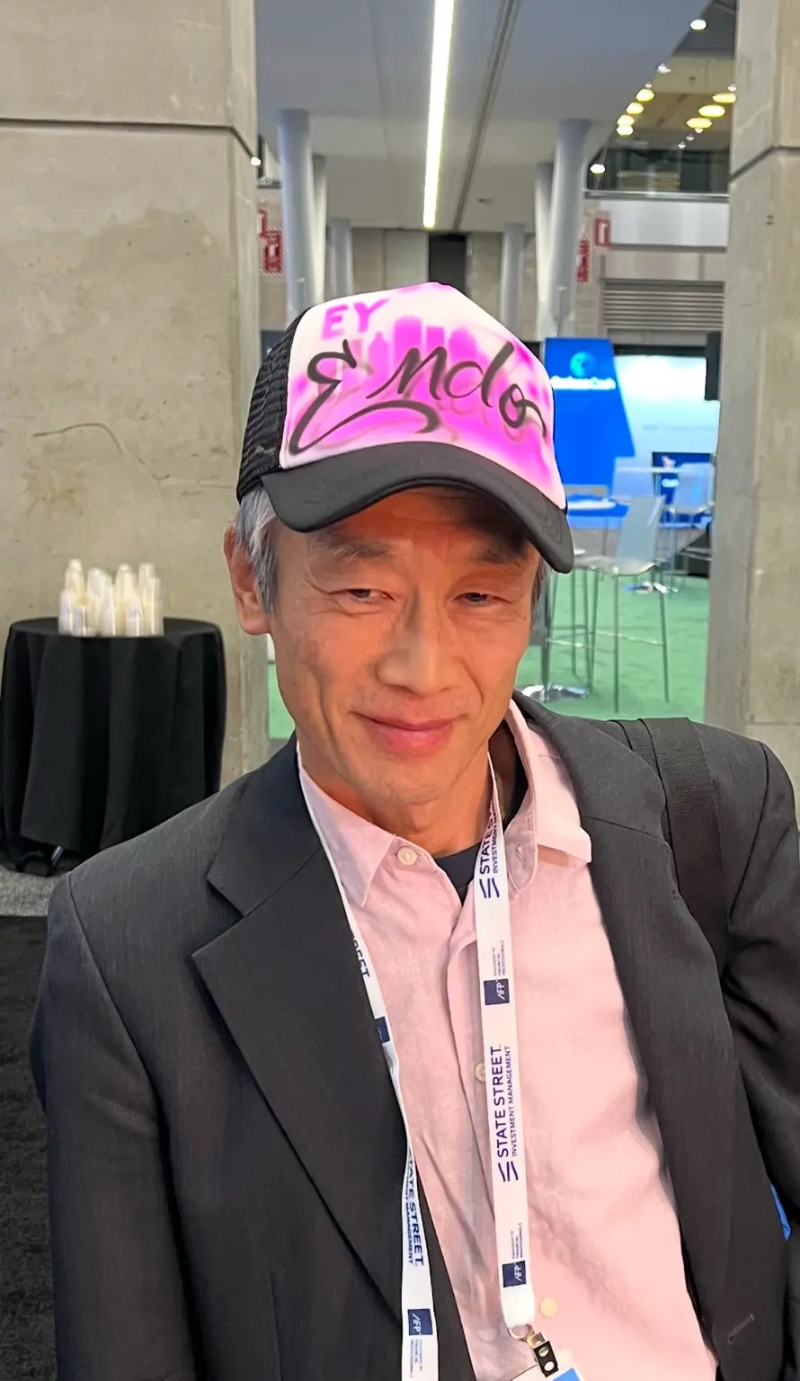 EY event guest wearing a pink personalized airbrushed trucker hat