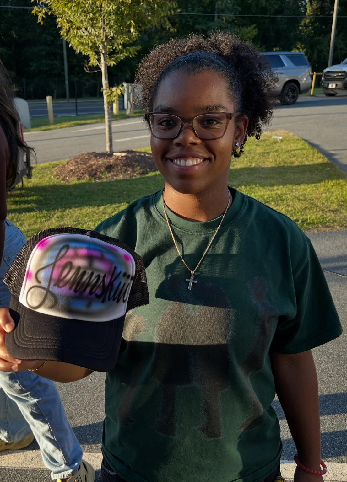Florida A&M University student with a personalized airbrushed hat — event photo 3