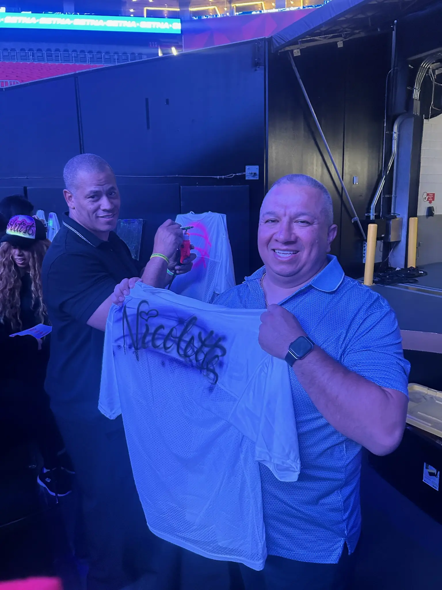 Guest displaying a custom name airbrushed football jersey in Atlanta