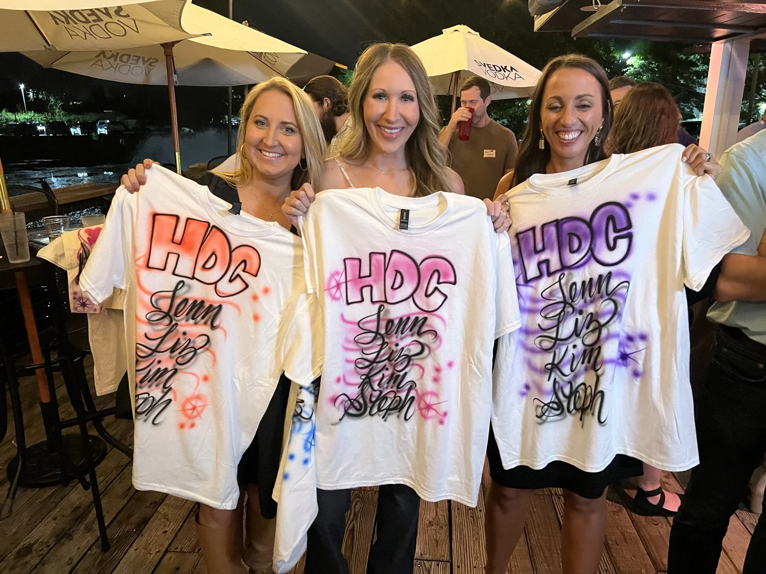 Knoxville class reunion guests displaying personalized airbrushed shirts