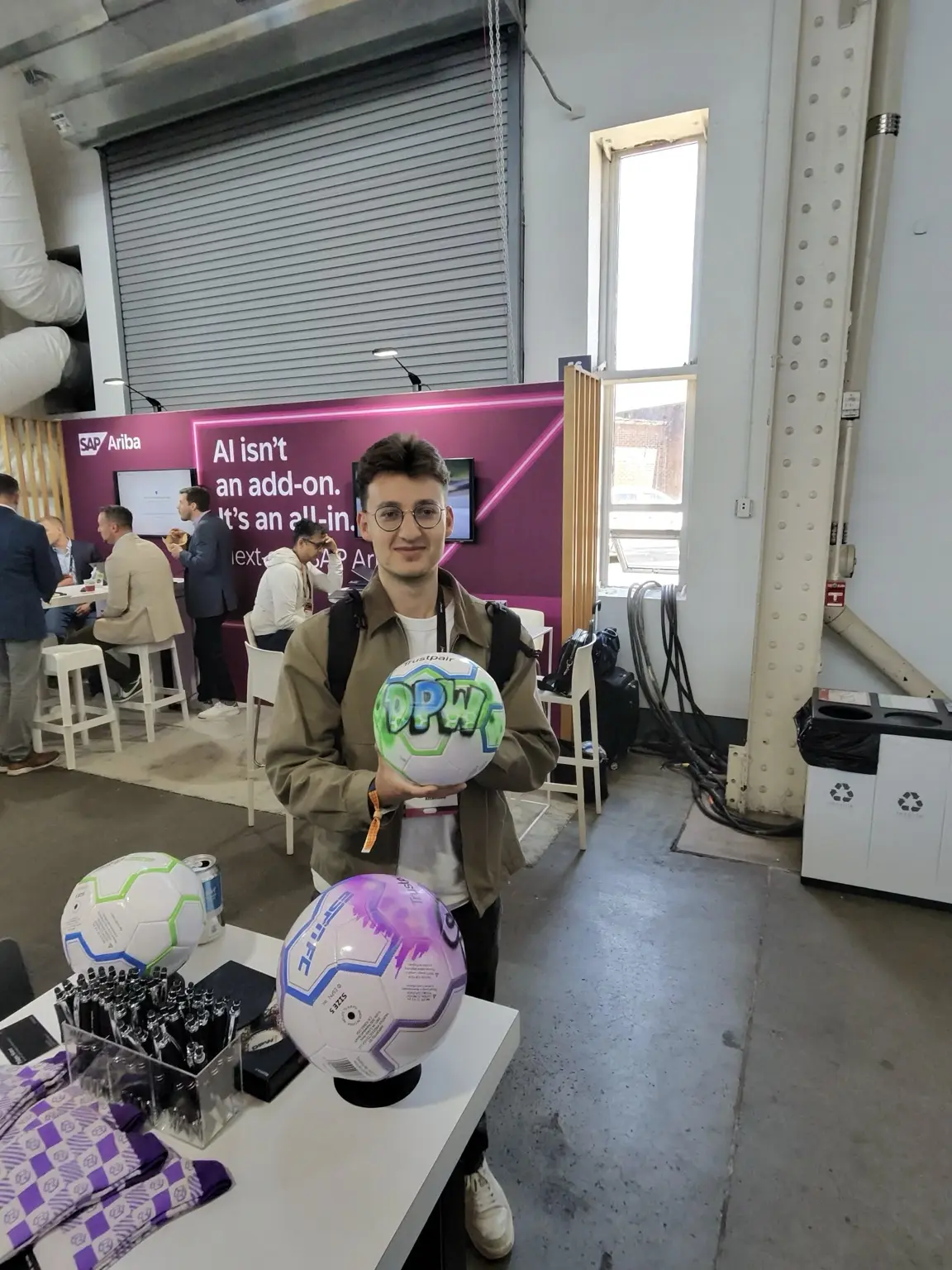 3JS artist airbrushing a soccer ball live at the Trustpair Brooklyn event
