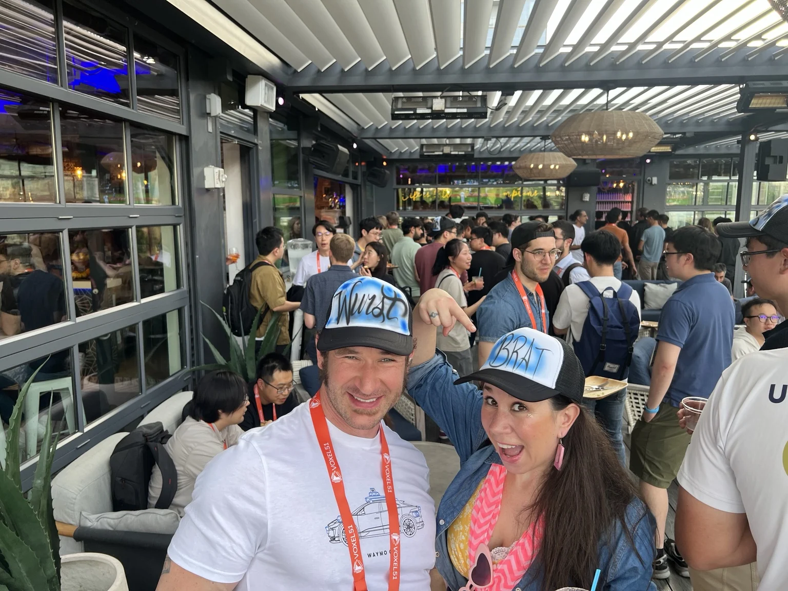 Corporate event guests wearing custom airbrushed trucker hats in Nashville, Tennessee