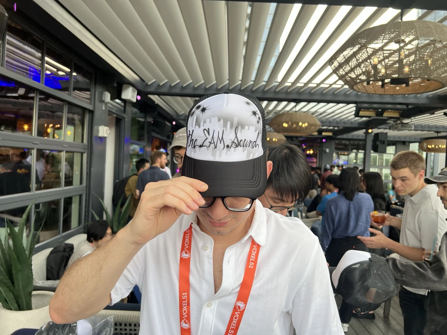 Guest showing a black and white custom airbrushed hat in Nashville, Tennessee