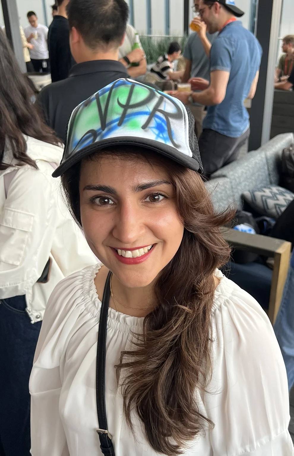 Guest wearing a colorful personalized trucker hat in Nashville, Tennessee