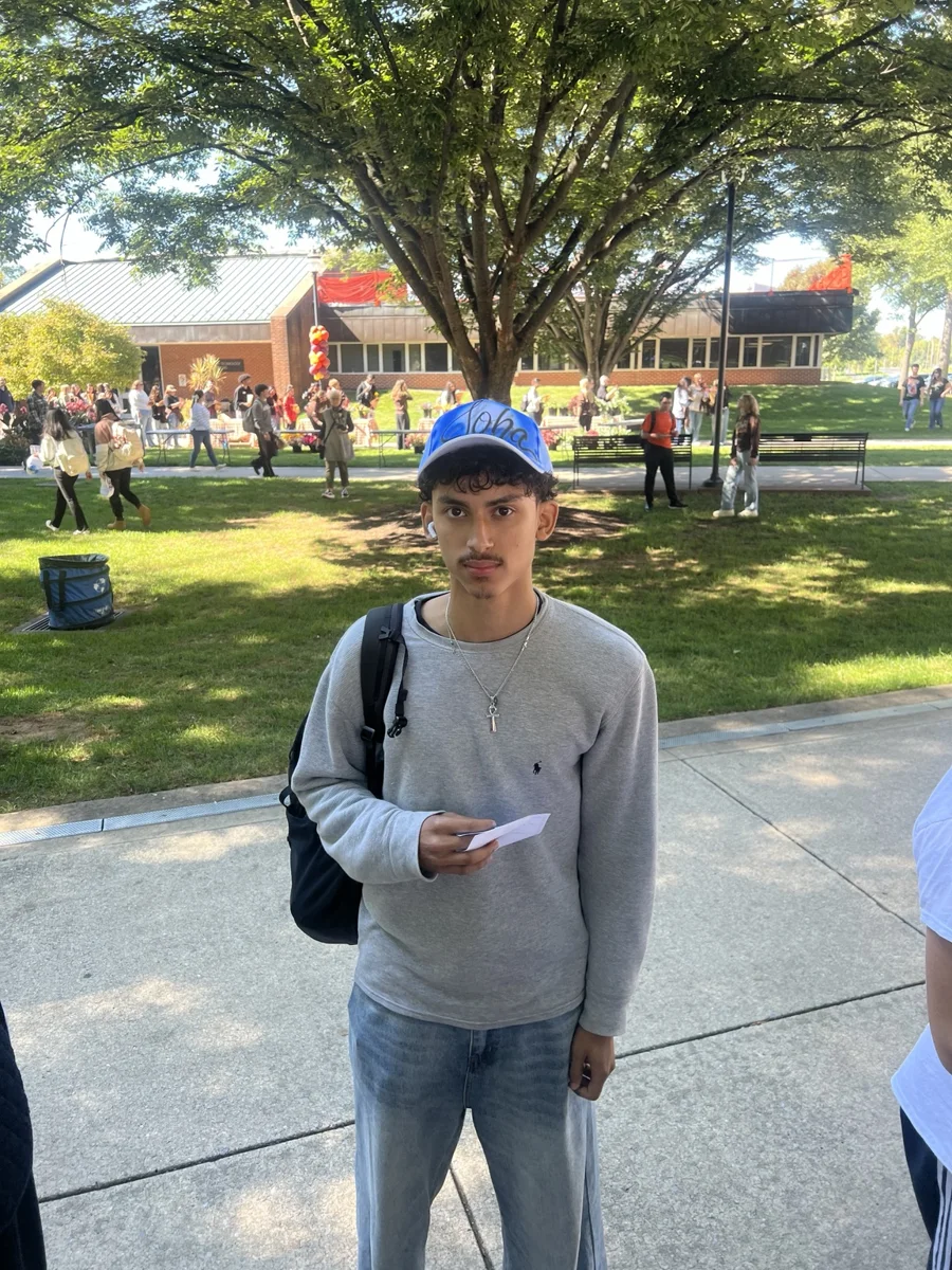 Guest wearing a blue personalized baseball hat at the Penn State Harrisburg activation