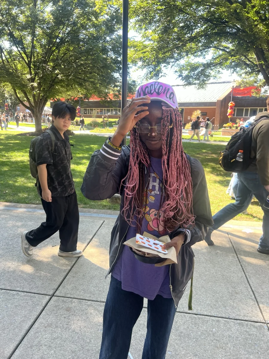 Guest with a pink airbrushed baseball hat at Penn State Harrisburg