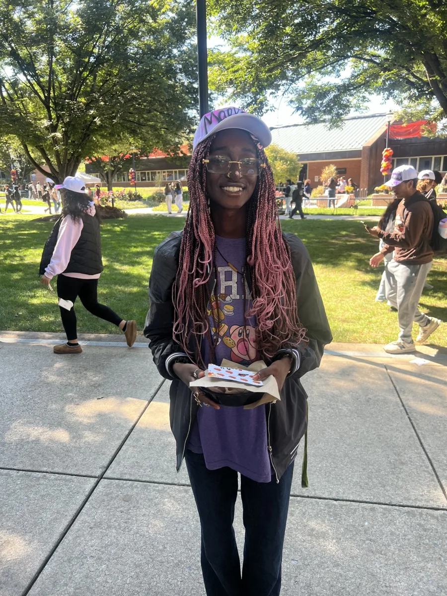 Guest wearing a custom baseball hat at the Penn State activation