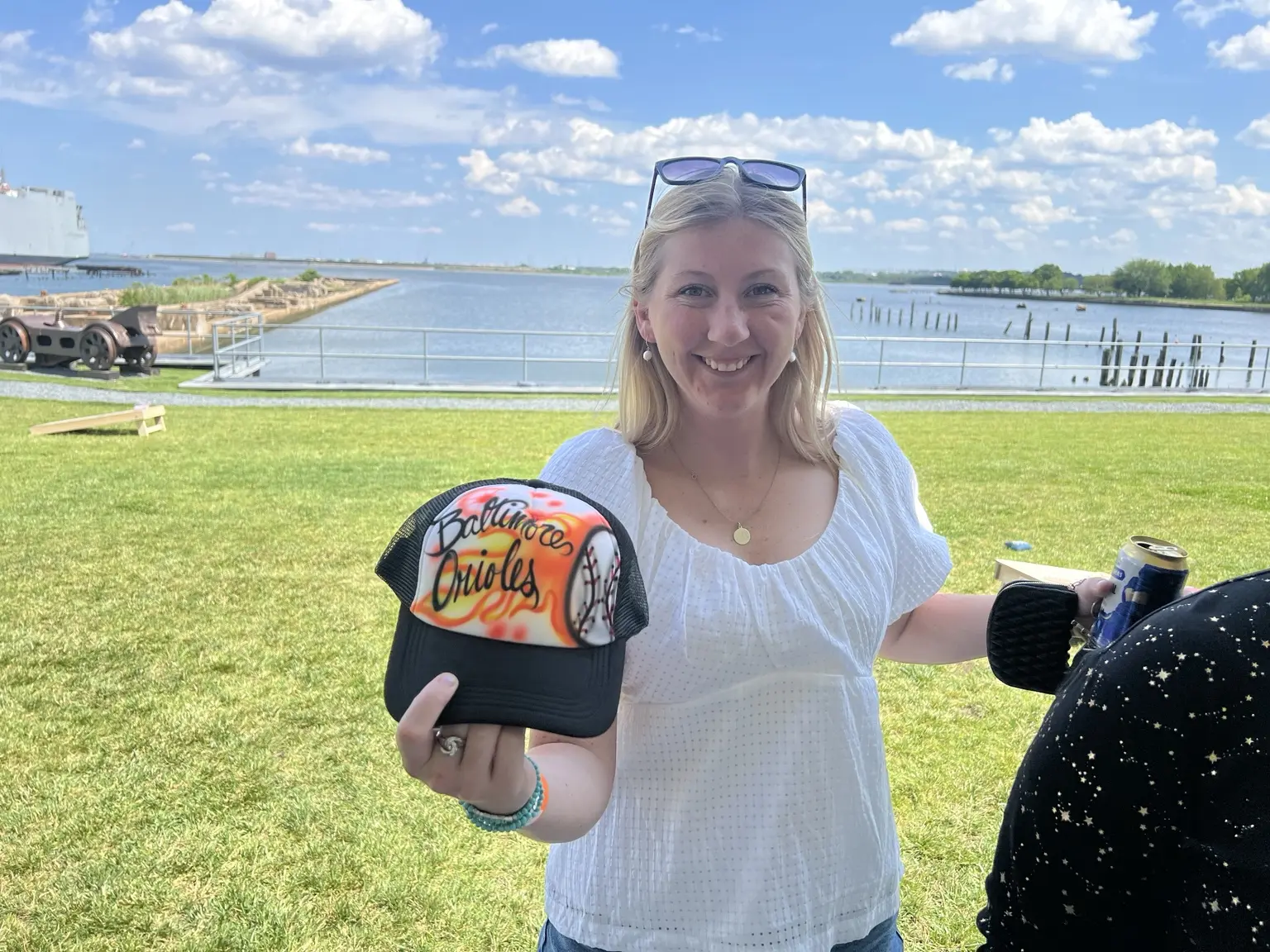 PwC event guest displaying a purple personalized trucker hat