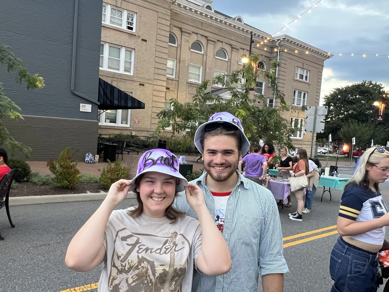 Students wearing personalized airbrushed hats at Roanoke College Fall Festival in Salem, Virginia