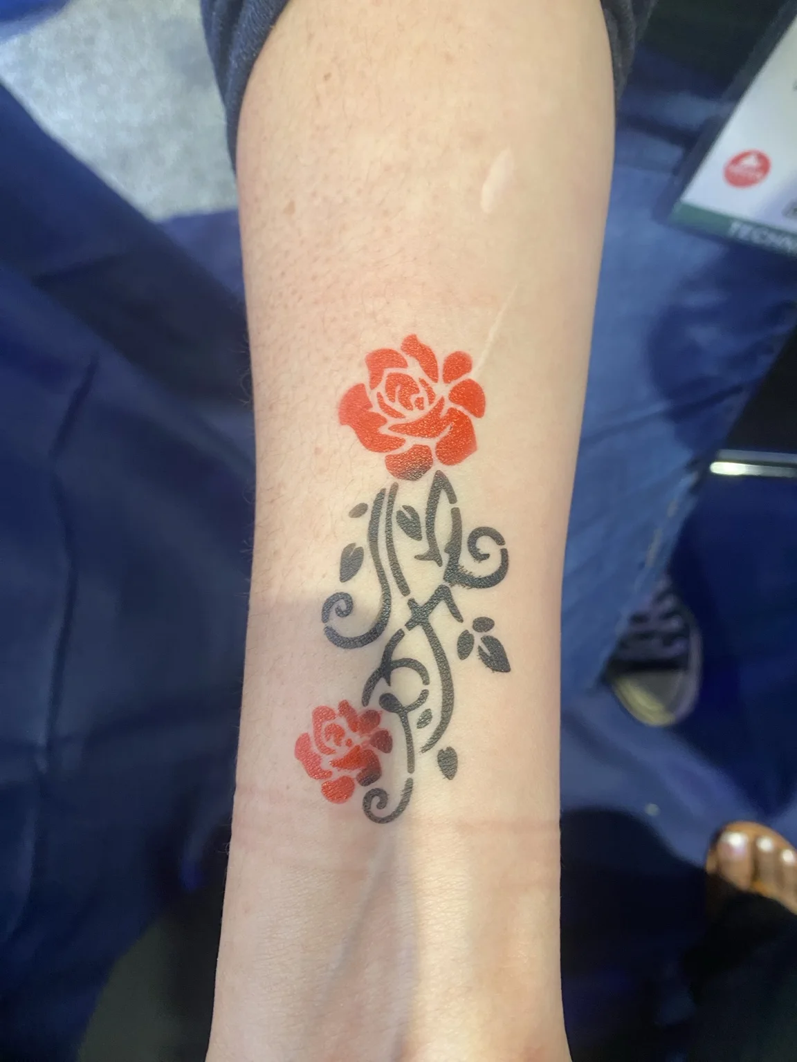 Rose and ornamental temporary airbrush tattoo at the Arista corporate event in Savannah, Georgia