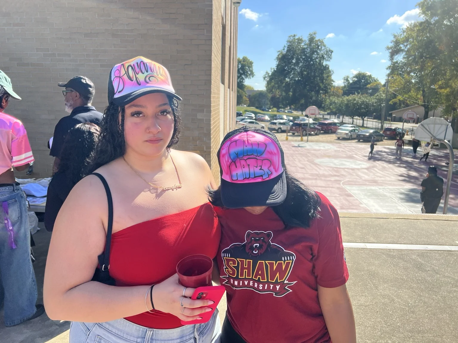 Shaw University guests with custom airbrushed hats in Raleigh