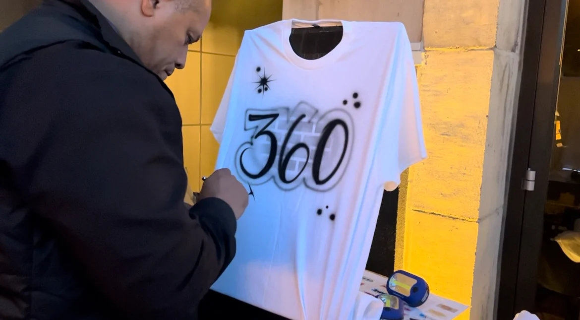 Artist adding details to a custom 360 T-shirt