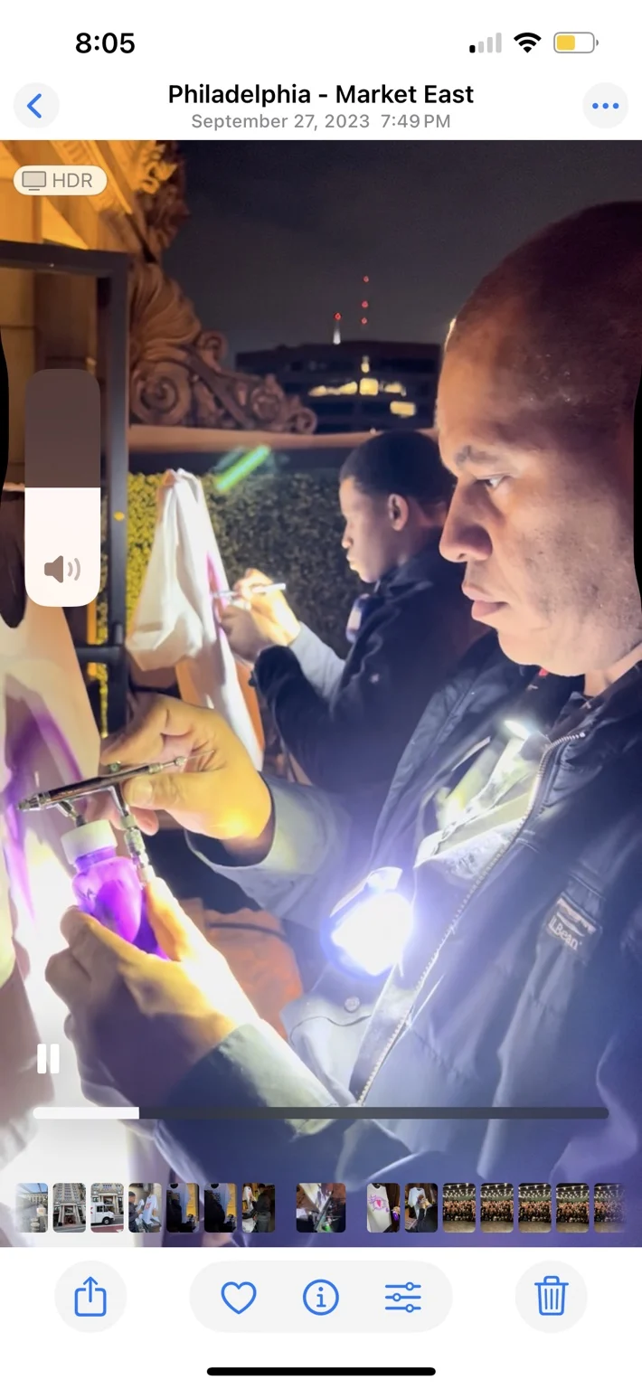Artists creating personalized shirts for Target event guests