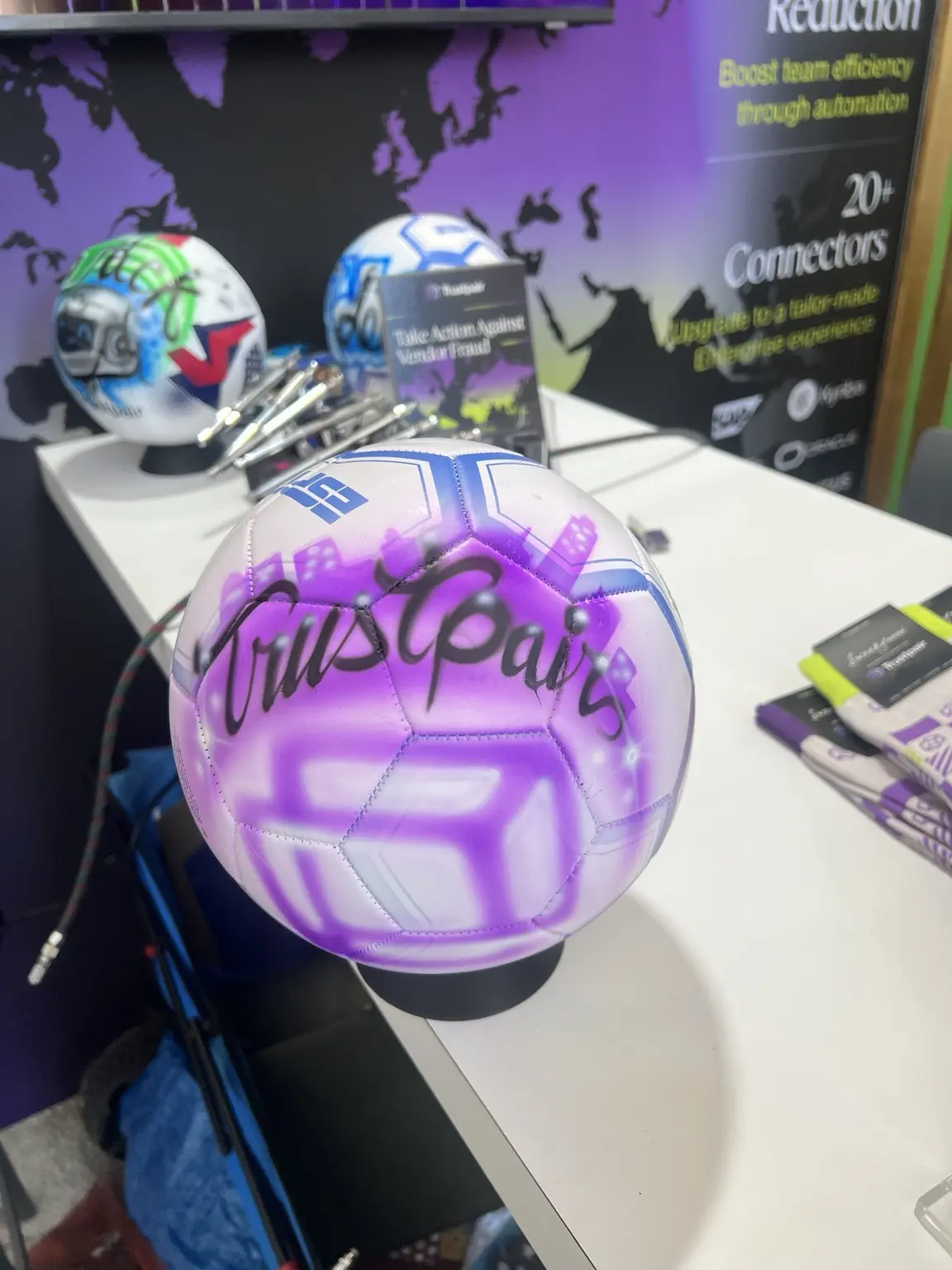 Purple airbrushed soccer ball featuring the Trustpair name