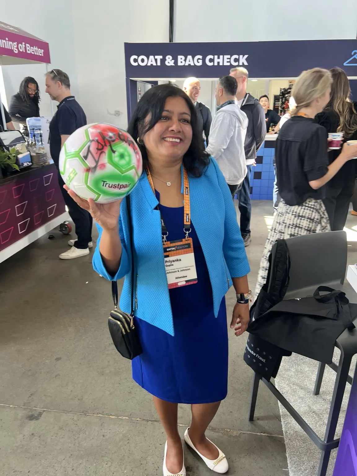 Trustpair guest displaying a green personalized airbrushed soccer ball in Brooklyn