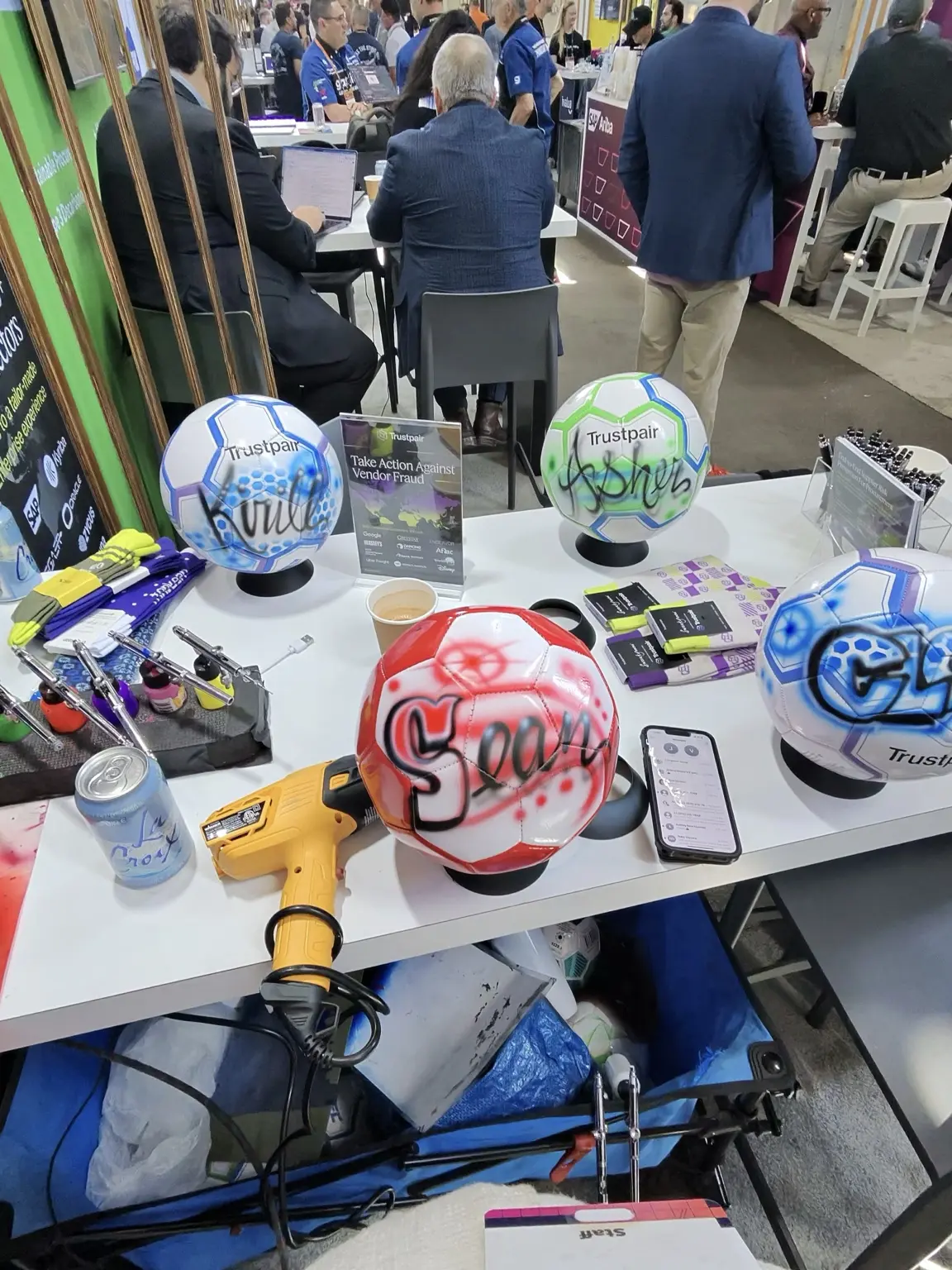 Display of colorful custom soccer balls at the Trustpair activation