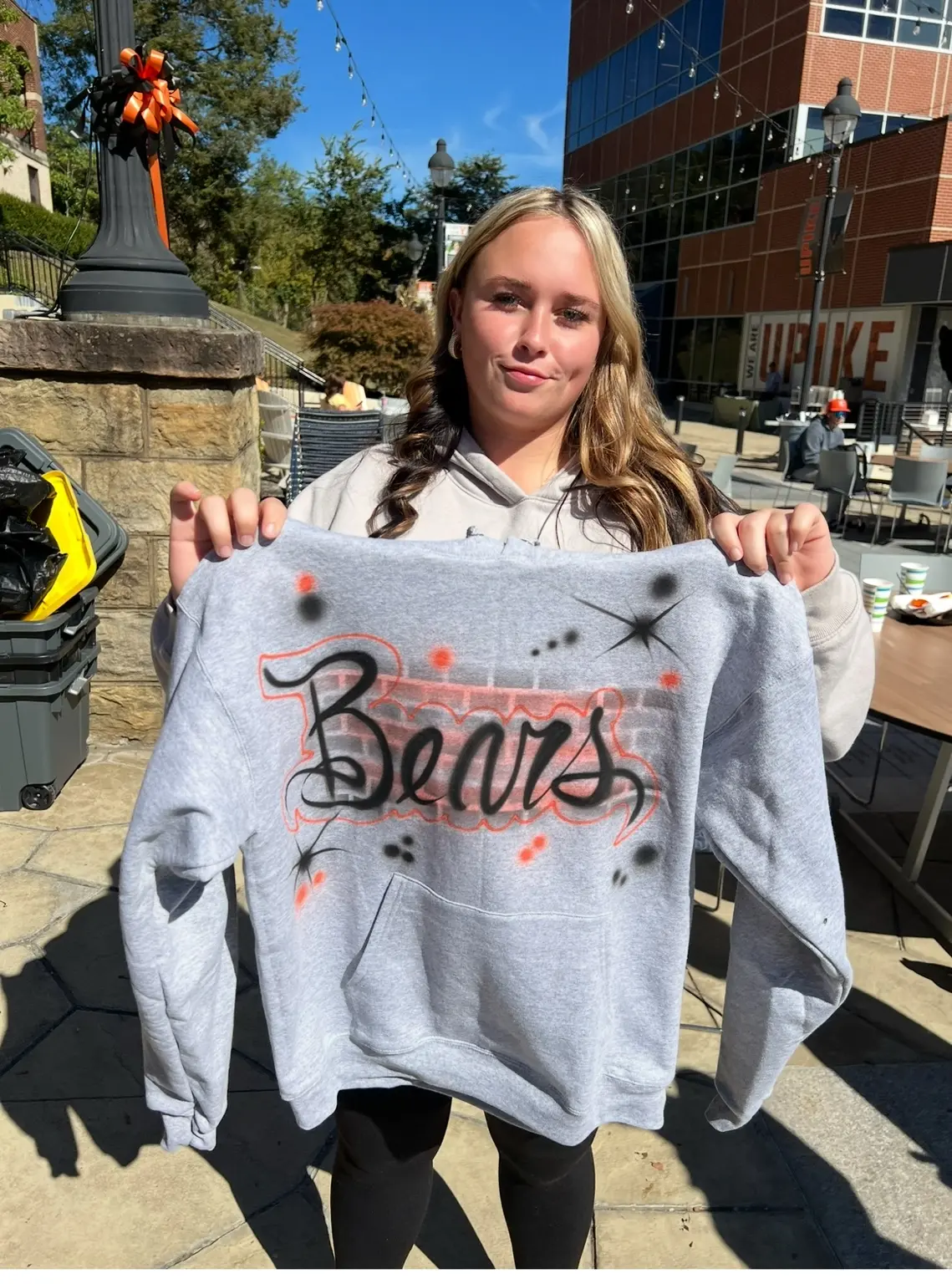 University of Pikeville student displaying a custom Bears airbrushed hoodie