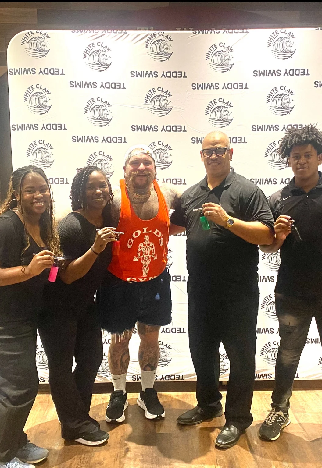 Teddy Swims with the 3JS Airbrushing team at the White Claw brand activation