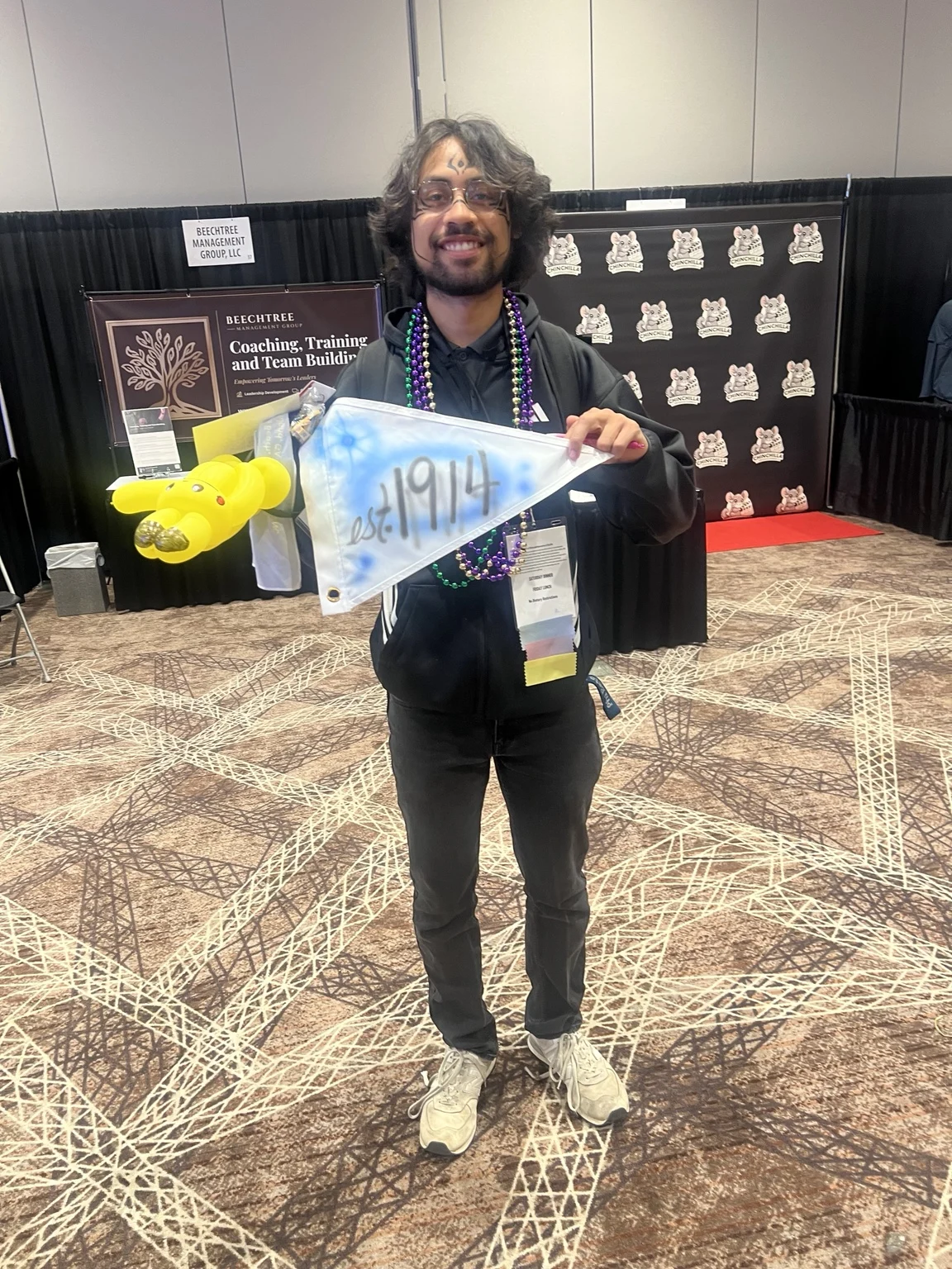 Winthrop University student displaying a blue custom airbrushed pennant